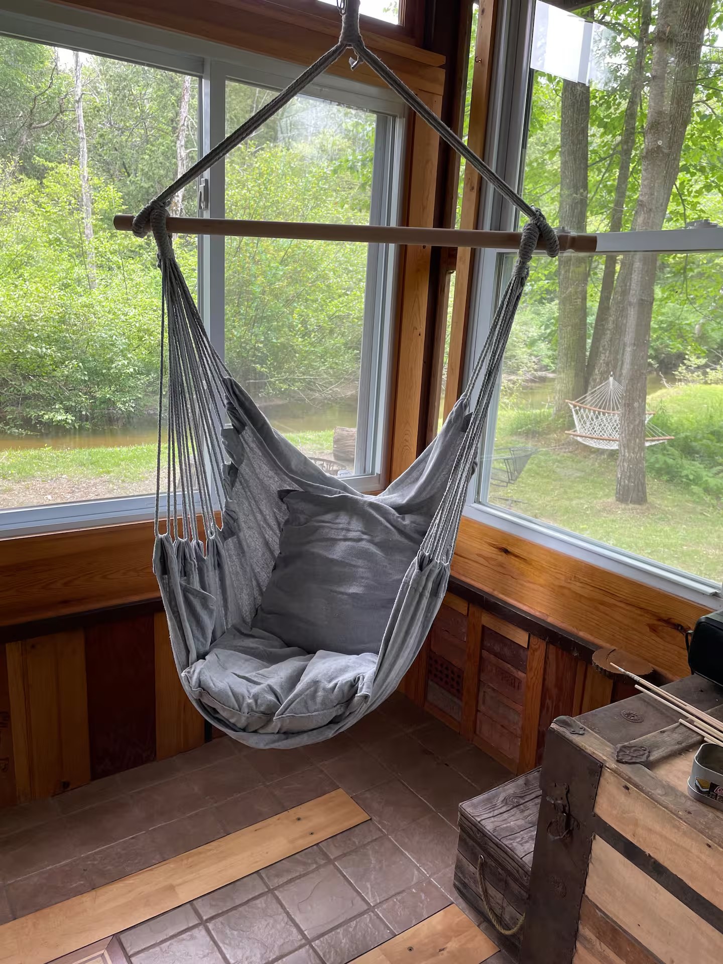 Hanging chair in screened porch